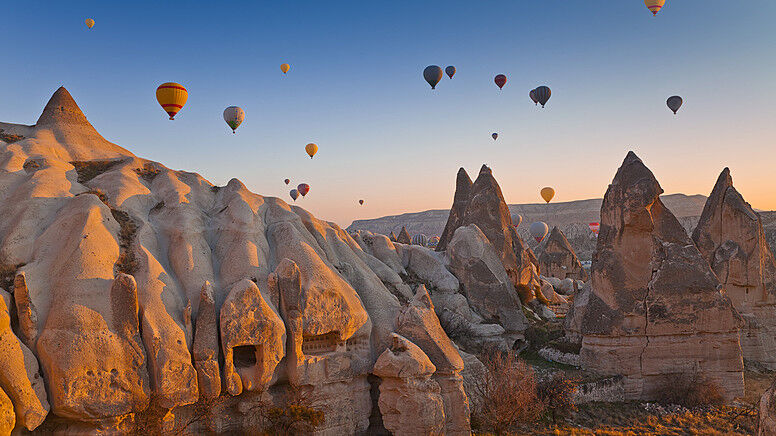 Hot-air balloons over the Göreme valleys at sunrise